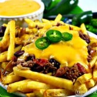 Chili Cheese Fries topped with jalapenos