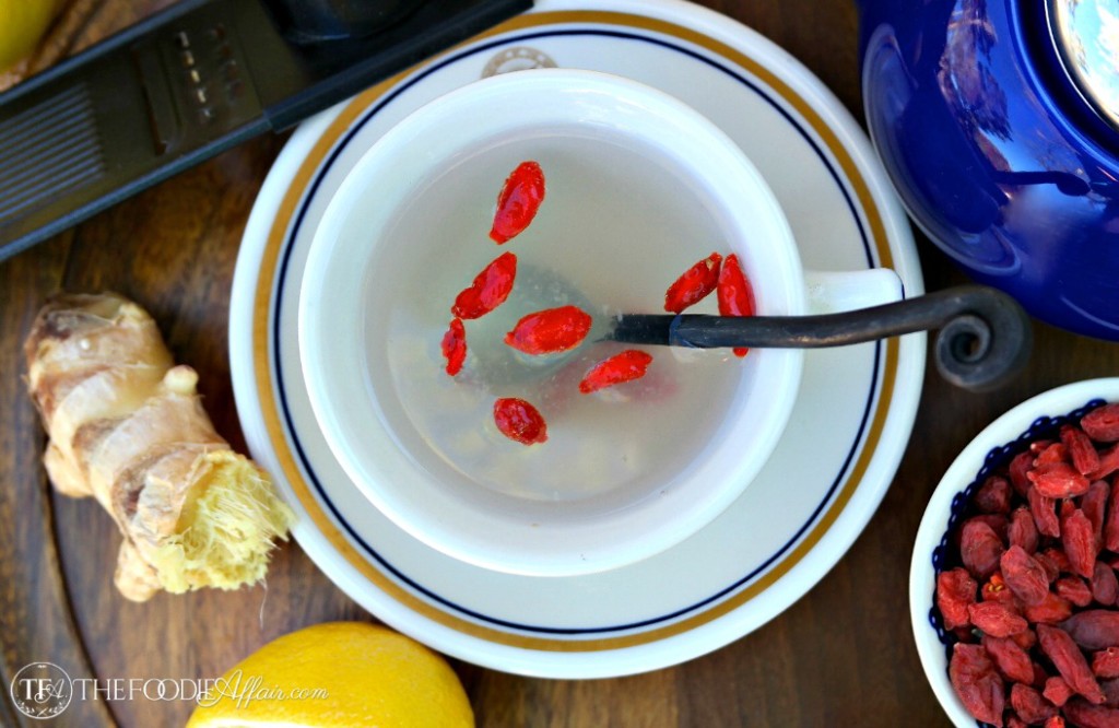  A mug of lemon ginger detox drink with gogi berries 