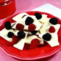 Fresh Berry White Chocolate Bark on a red plate