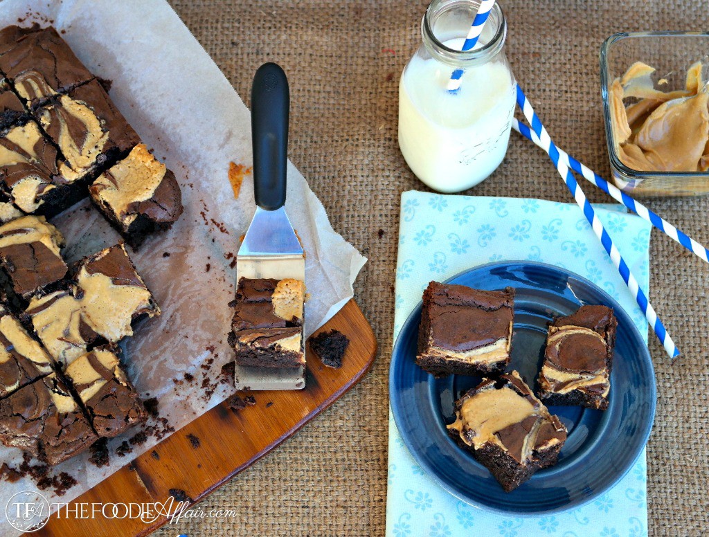 Peanut Butter Brownies on a blue plate with a glass of milk