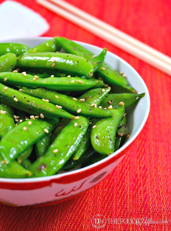 Sugar snap peas in a white and red bowl