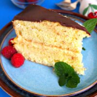 Slice of Boston cream pie on a blue plate