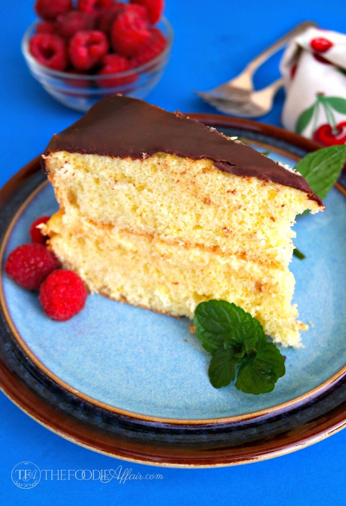 Slice of best Boston cream pie on a blue plate