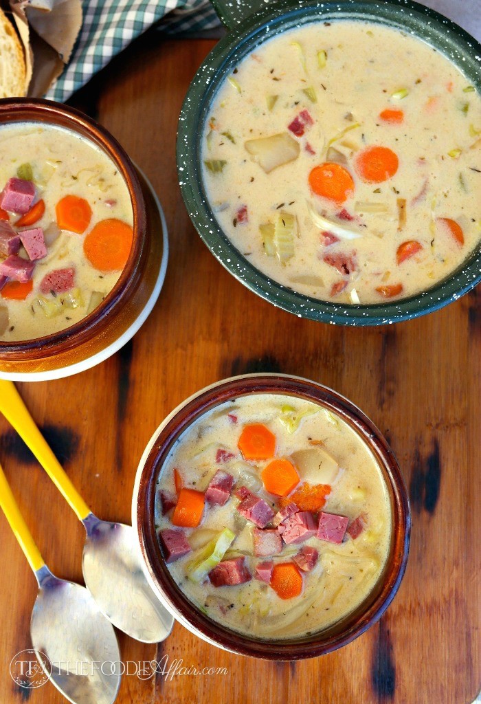 Three bowls of Corned Beef and Cabbage Chowder on a brown table