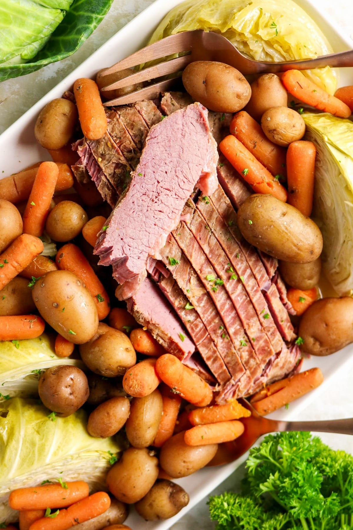 A complete Corned beef meal on a white platter.