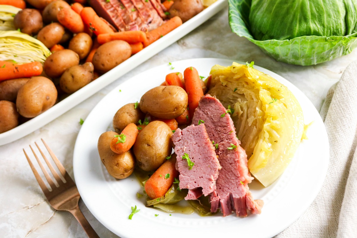 A plateful of corned beef with cabbage.