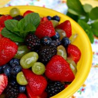 fruit salad in a yellow serving bowl