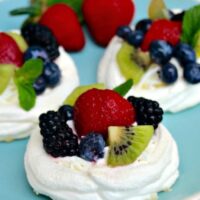 Individual Pavlova Nests topped with fresh fruit