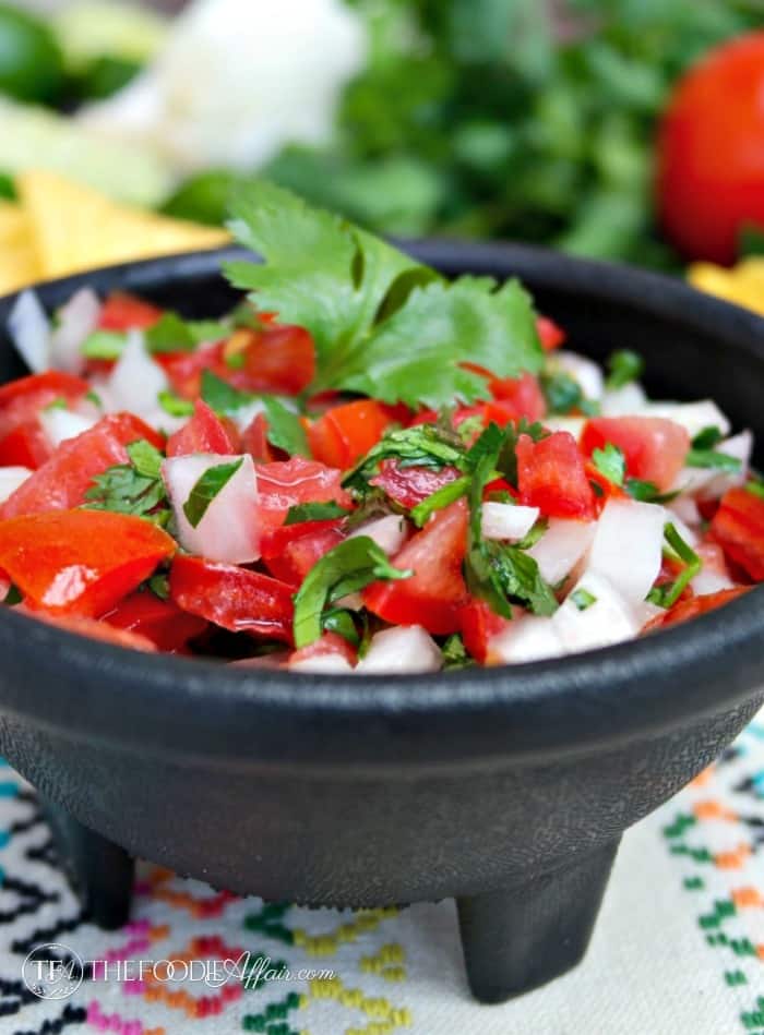 Pico de Gallo a fresh salsa in a black serving bowl