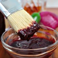 Blueberry Bourbon Barbecue Sauce with a basting brush
