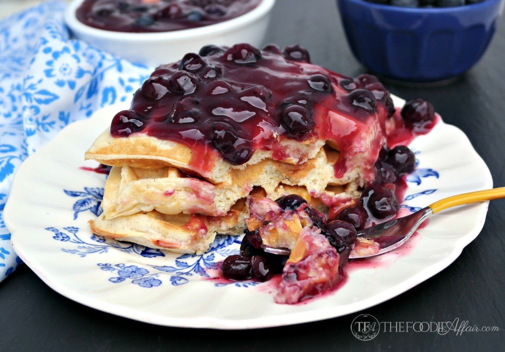 Homemade blueberry sauce over waffles