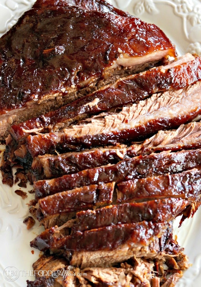 oven cooked brisket on a white serving plate