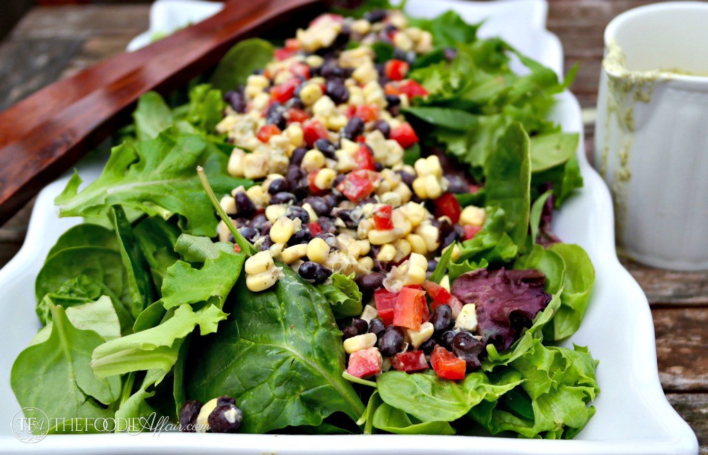 Black Bean and Corn Salad with a yogurt cilantro dressing on a white platter