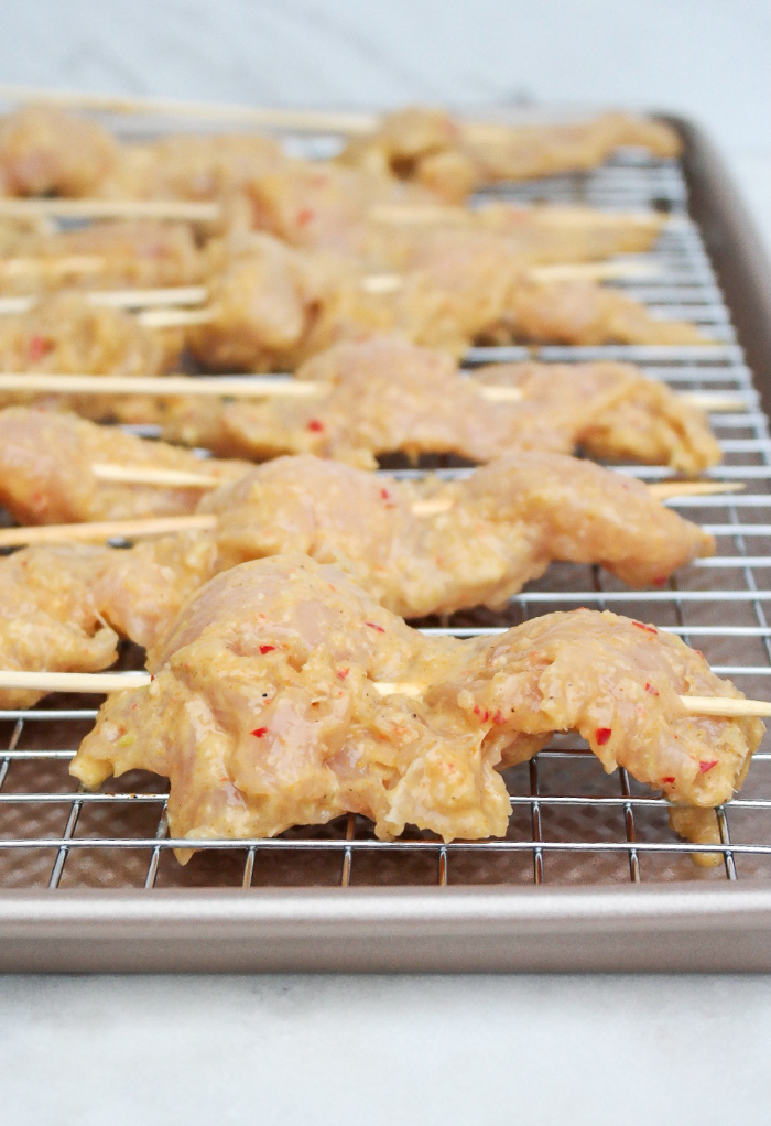 Chicken skewers ready to be baked in the oven.