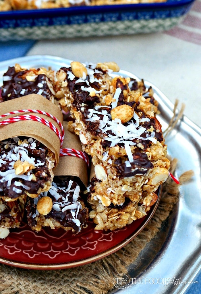 Layered dark chocolate, coconut and nuts are in this homemade granola bar! The Foodie Affair