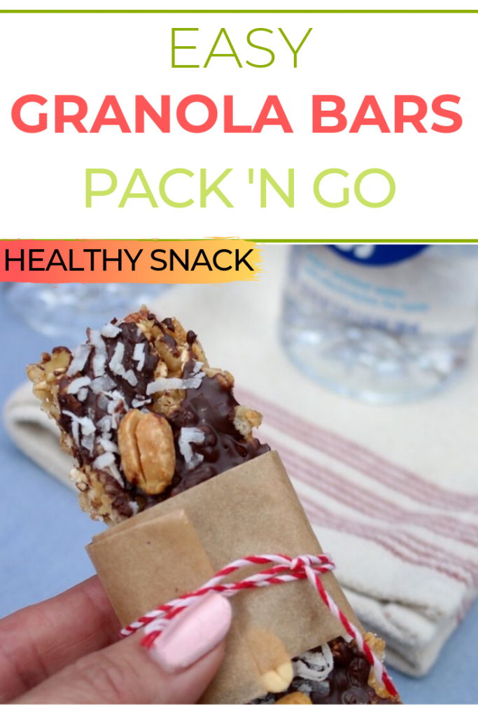 Homemade granola bars lightly sweetened with honey.  Add a layer of dark chocolate and coconut flakes topped with peanuts!  Easy on the go snack idea! #snack #homemade #granola #recipeidea #healthy #thefoodieaffair
