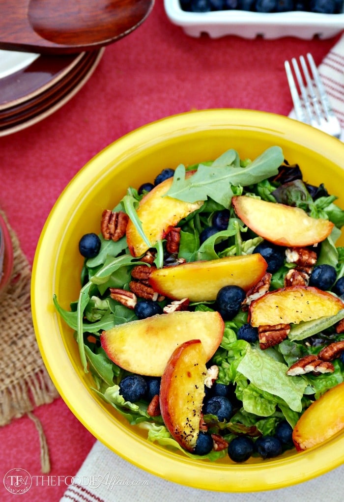 Green salad and summer fruit with light poppy seed dressing 