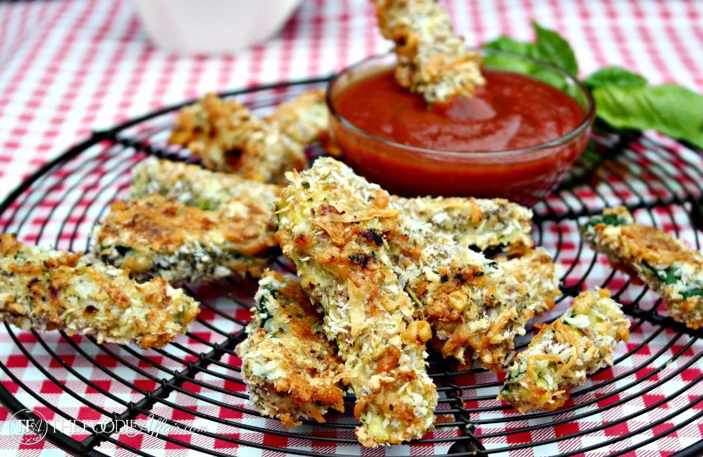 baked zucchini fried on a baking rack with pizza sauce