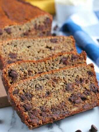Here we see a few slices of the banana bread with chocolate chips stacked up and ready to be shared.