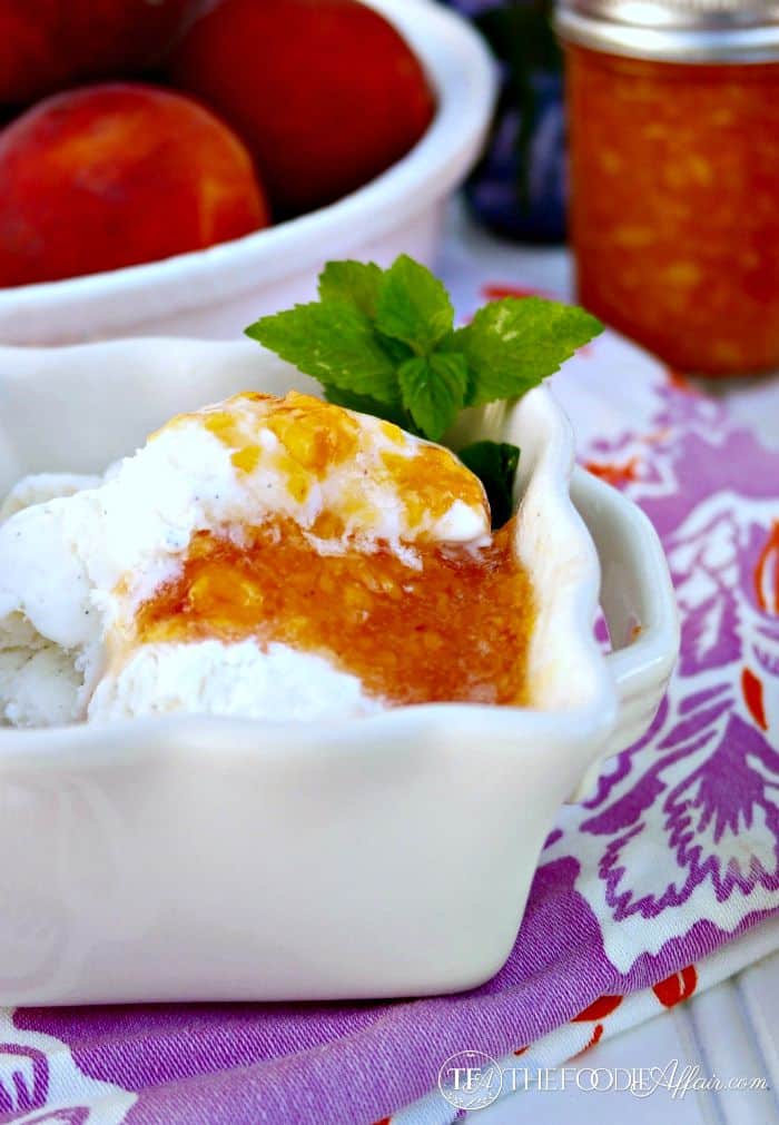 Peach freezer jam over vanilla ice cream
