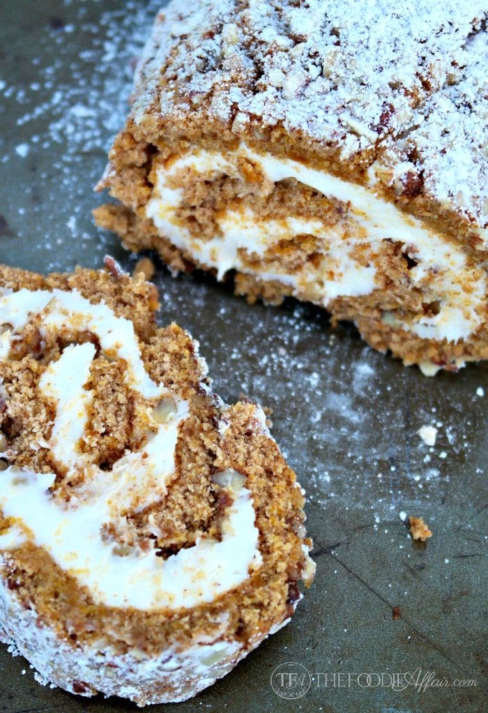 Easy Pumpkin roll with cream cheese filling on a serving platter