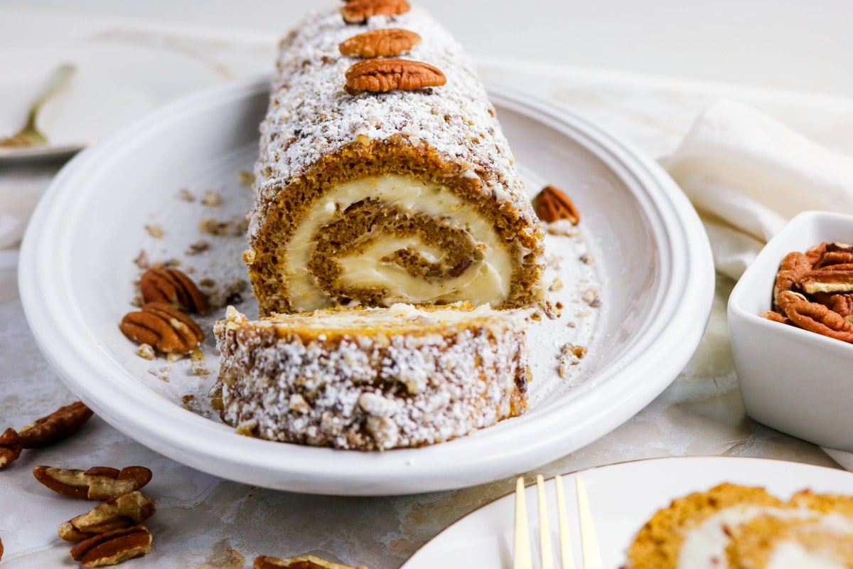 Pumpkin roll cake cut before serving.
