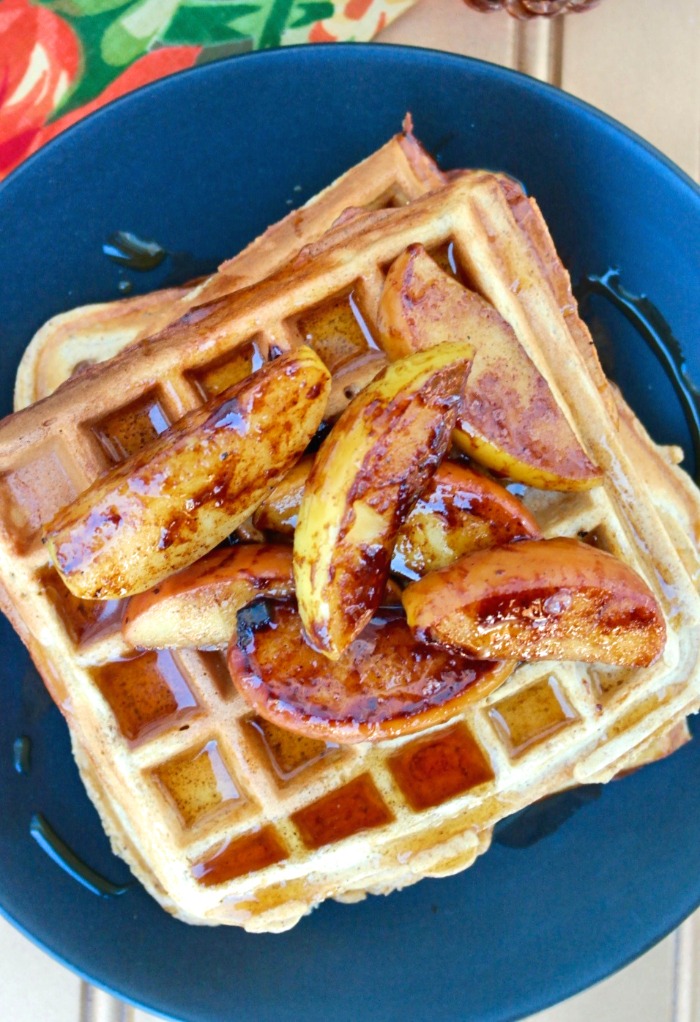 Cooked whole wheat waffle recipe on a black plate. 