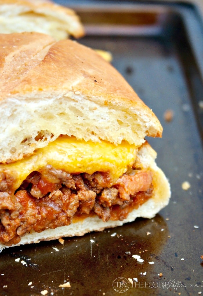 This Bacon Cheeseburger Stuffed French bread is packed with a flavorful beef mixture and then topped with a gooey layer of cheese! Add additional condiments for a full burger experience! The Foodie Affair