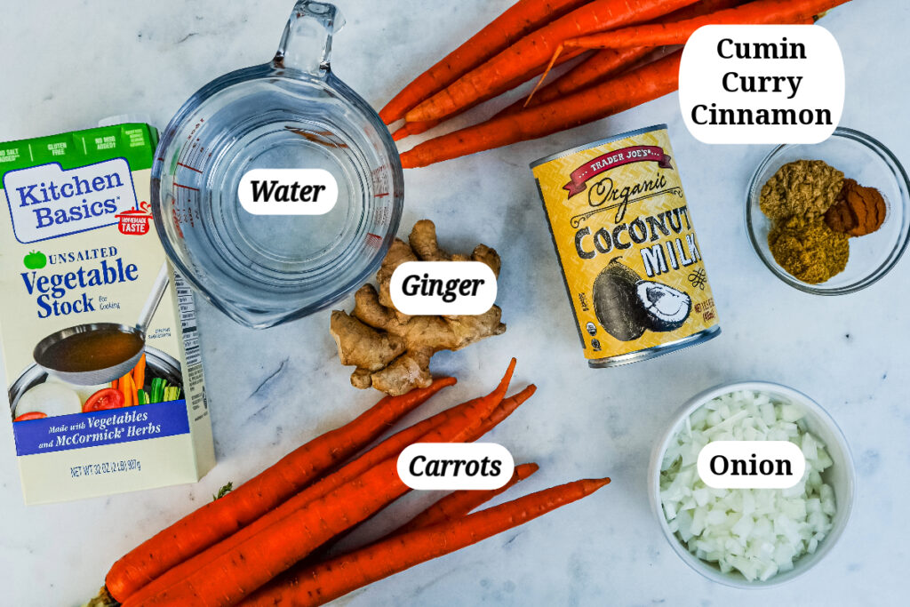 Ingredients needed to make vegan carrot curry soup.