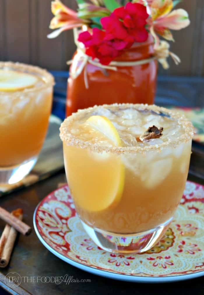 Cozy up with an Apple Cider Margarita this Fall! This classic cocktail is a delicious mix of tequila, orange liquor and apple cider. The Foodie Affair