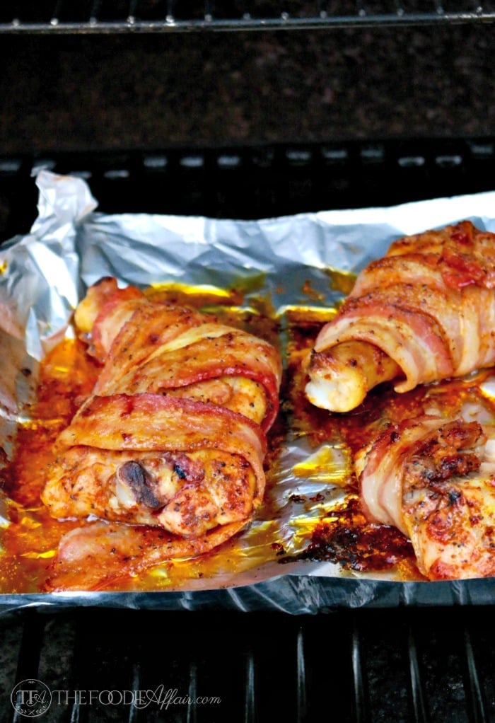 cooked grilled chicken on bbq grates with foil