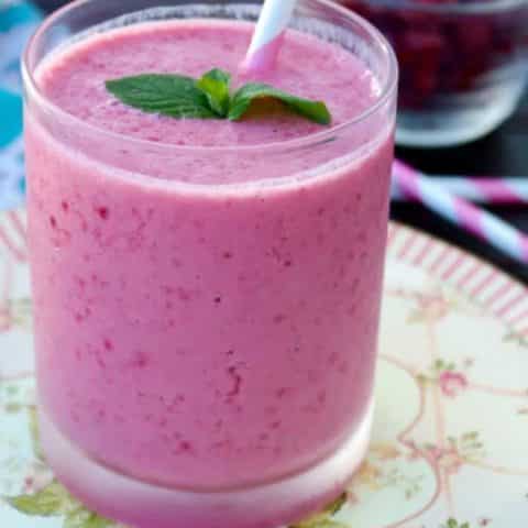Cranberry Raspberry Smoothie with a pink straw