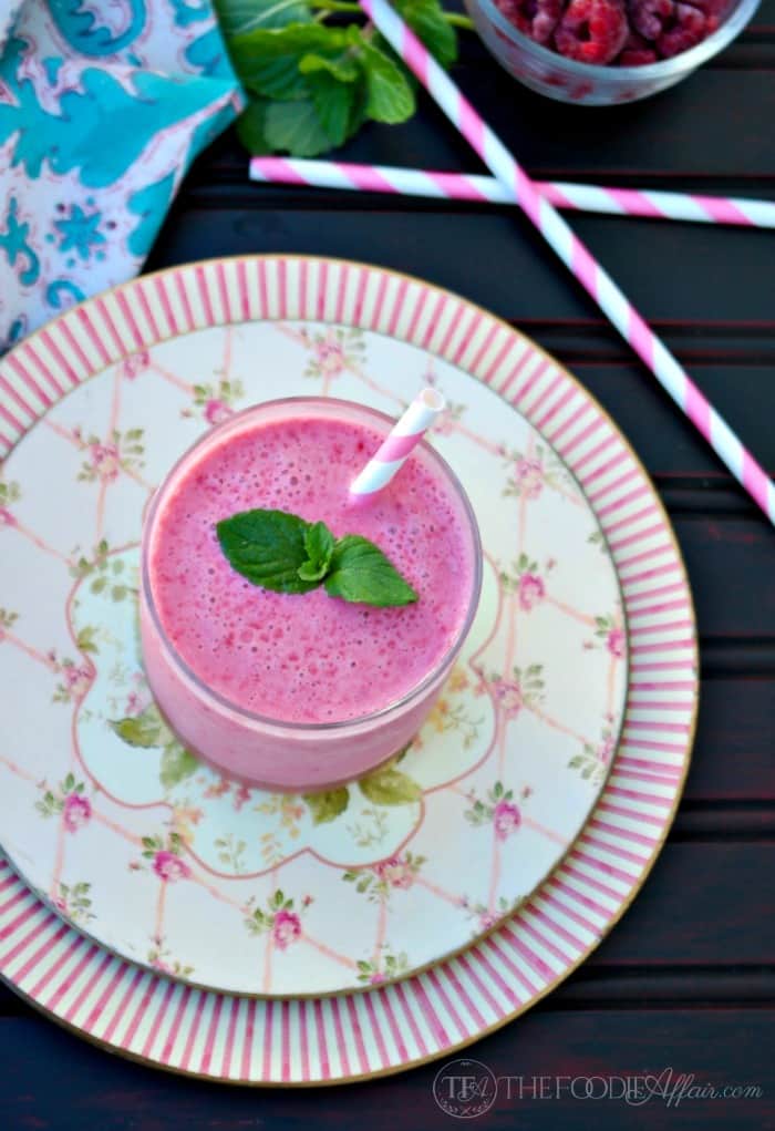 Cranberry Raspberry Smoothie made with non-fat Greek yogurt adding a protein to keep you feeling satisfied! Serve for a meal replacement or for a snack! The Foodie Affair