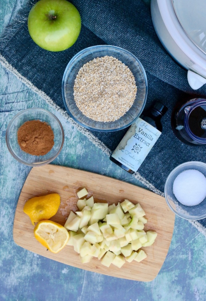 An over head view of the ingredients needed to make slow cooked apple cinnamon oatmeal. 