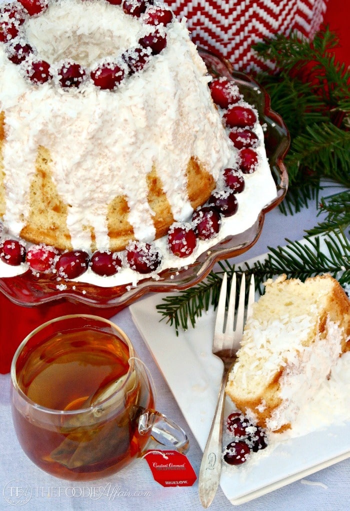 Vanilla Chiffon Cake with Sugared Cranberries is a light and airy cake served with hot tea. Enjoy for a special occasion. The Foodie Affair