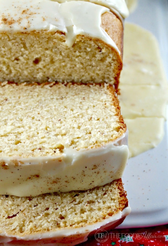 sliced eggnog bread on a white serving platter