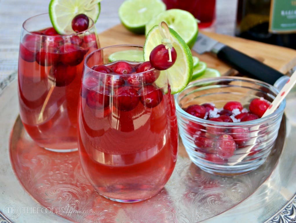 Samsung Holiday Spritzers with cranberry and lime is a tasty and festive cocktail that is perfect for entertaining! The Foodie Affair