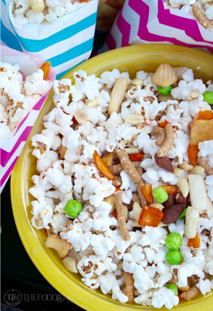 Asian popcorn snack mix to share at a party, family game night or while watching sports! This healthy BOOMCHICKAPOP is made with simple ingredients and will be your favorite low calorie snack! The Foodie Affair