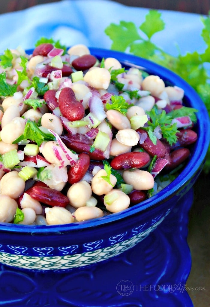 Three bean salad with a light dressing makes a delicious side dish or light lunch when served with a bed of lettuce. The Foodie Affair