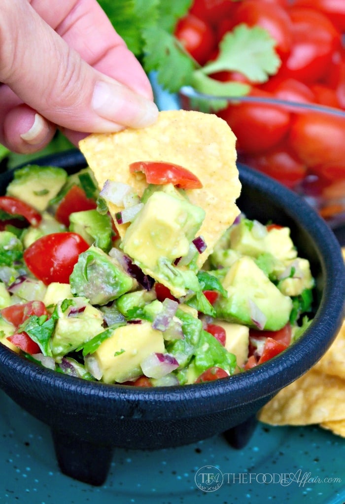 This simple Chunky Avocado Dip can be eaten with chips or served over a variety of dishes adding a healthy layer of fresh ingredients! The Foodie Affair