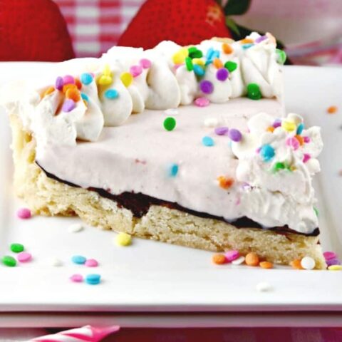 Shortbread Ice Cream Cookie Cake on a white plate with colorful sprinkles