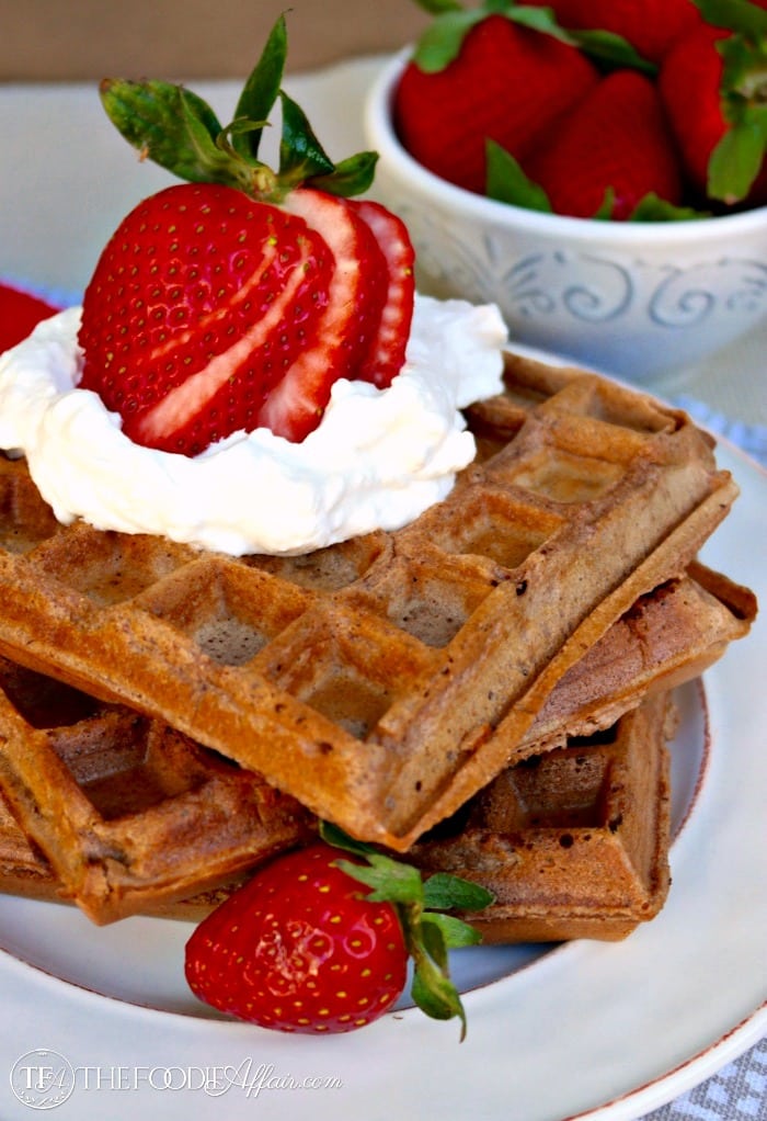 Delicate Whole Wheat Chocolate Waffles with almond meal for an extra dose of protein. Serve with fruit and freshly whipped cream! The Foodie Affair 