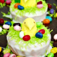 Peeps Baked Lemon Cake Donuts perched in nests are the perfect treats to add to your Easter brunch menu! Fresh lemon flavor that is sweet and slightly mouth puckering!