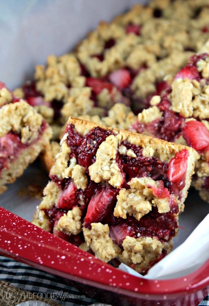 Strawberry Oat Bars with chia seed jam in a red baking pan
