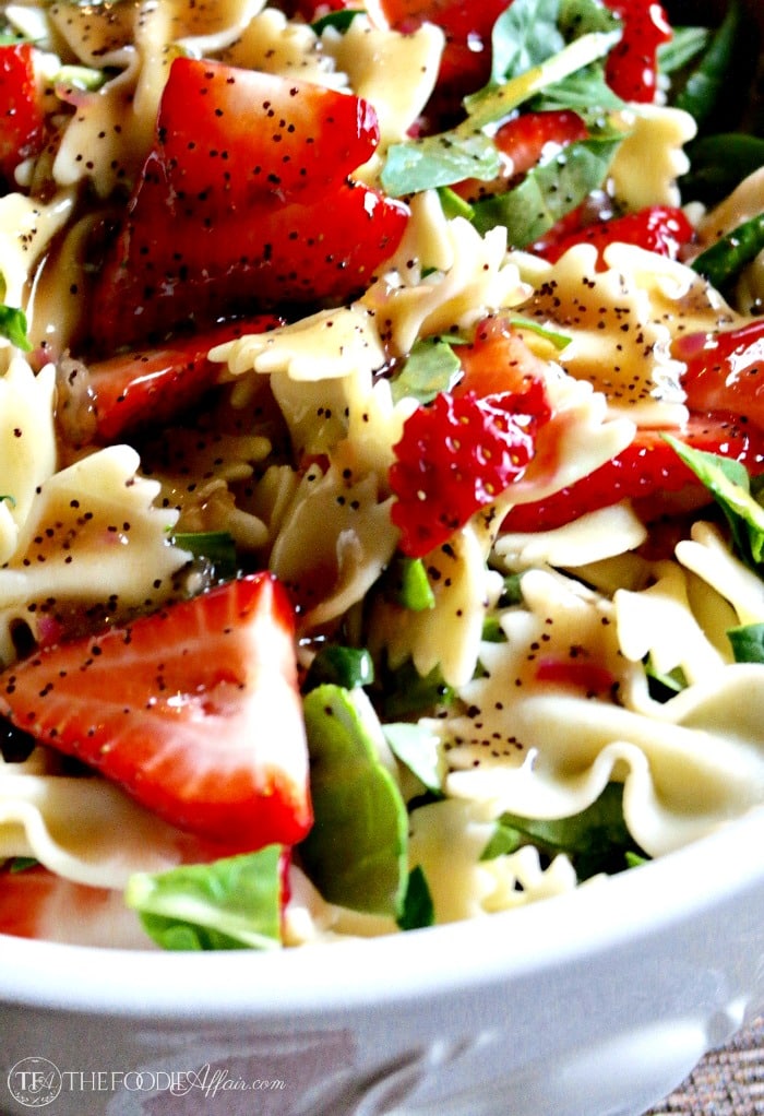 Strawberry Spinach Pasta Salad in a white bowl 