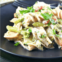 chicken vegetable casserole on a black plate