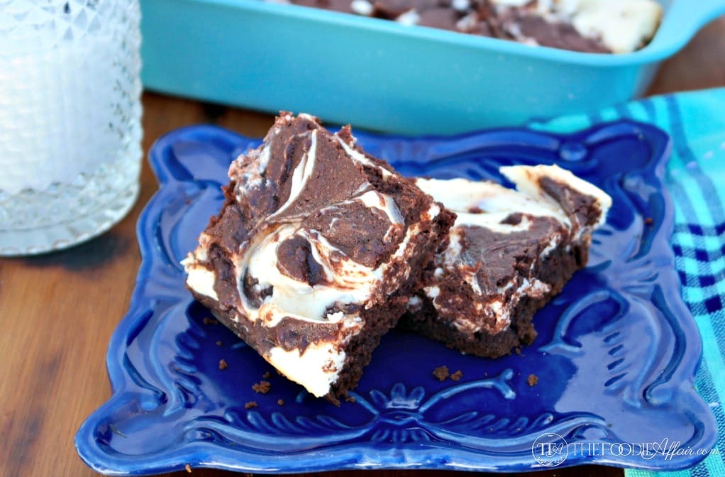 Low Carb Cheesecake Brownies are a delicious guiltless treat! These gluten free and low sugar brownies are two favorite desserts combined into one tasty treat! The Foodie Affair