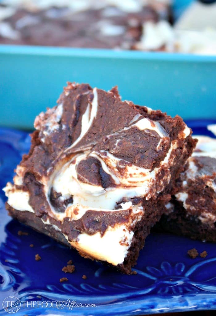 Low Carb Cheesecake Brownies are a delicious guiltless treat! These gluten free and low sugar brownies are two favorite desserts combined into one tasty treat! The Foodie Affair