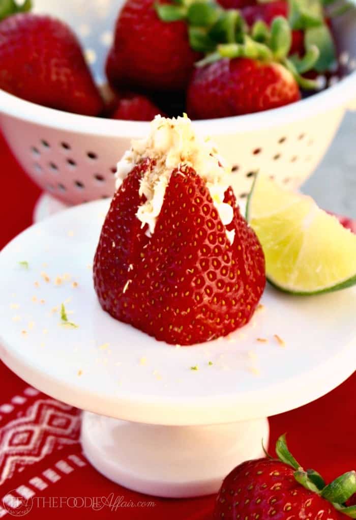 Cheesecake Stuffed Strawberries with coconut and lime flavors for a tropical twist! Low-carb treats are the perfect finger dessert!