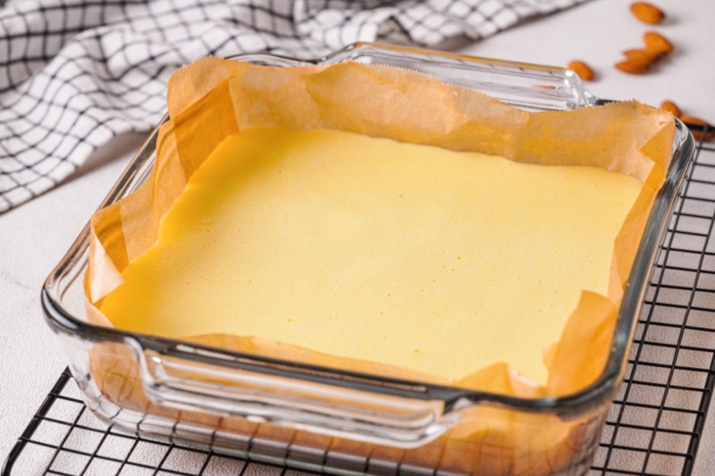 Lemon bars in a baking dish before baking. 